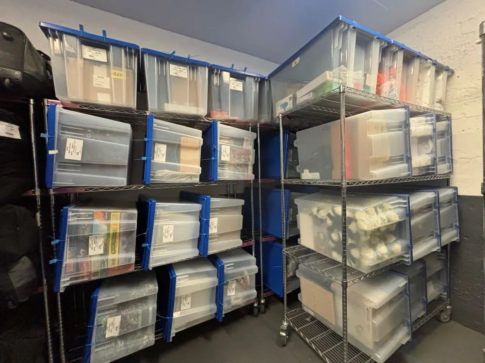 A bunch of bins stored in a room.