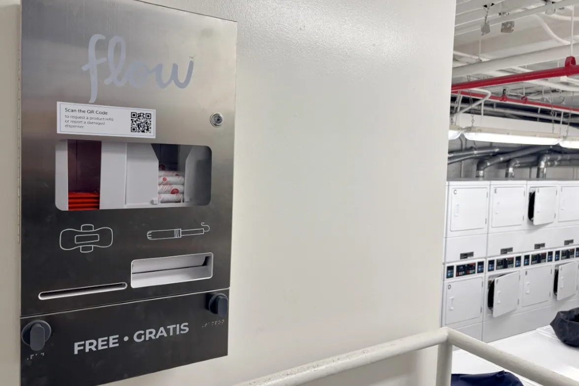 A Flow menstrual product dispenser in a residence hall laundry room