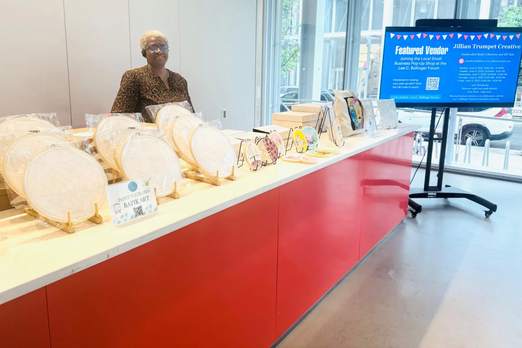 A vendor showcases her goods at the Lee C. Bollinger Forum.